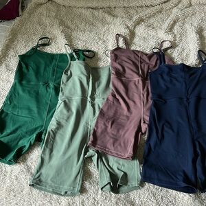 Bundle of 4 jumpsuit onesies size medium